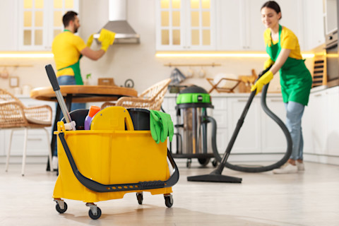 A cleaning team are working on a house.